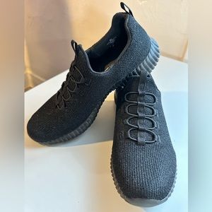 Women’s size 8.5 slip on Skechers. Black with metallic threads and memory foam.